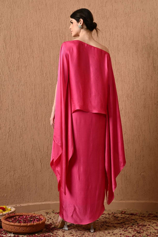 Luxury Pink Kaftan Dress with Draped Skirt by Sunanta Madaan – Elegant designer kaftan dress for women, perfect for weddings, festive wear, and party occasions. This Indo-Western kaftan gown features a stylish draped skirt for a modern, sophisticated look. Shop designer kaftan dress online in India from Sunanta Madaan, a premium women’s fashion brand in Gurgaon. Explore the latest kaftan-style party dresses