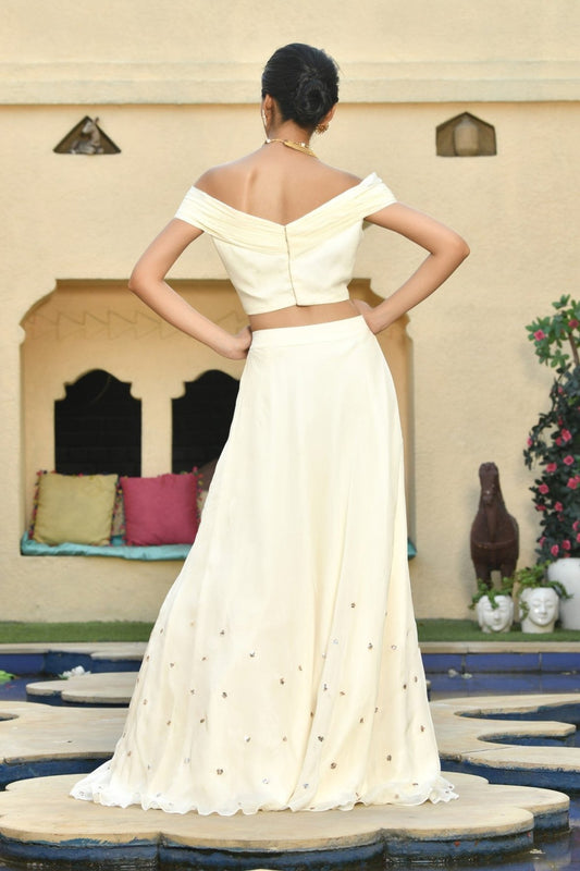 Ivory Indo-Western lehenga set, perfect for festive wear, occasion wear, and marriage party wear. This trending bridal lehenga combines traditional and western styles, making it a stunning choice for party wear with designer details. Sunanta Madaan