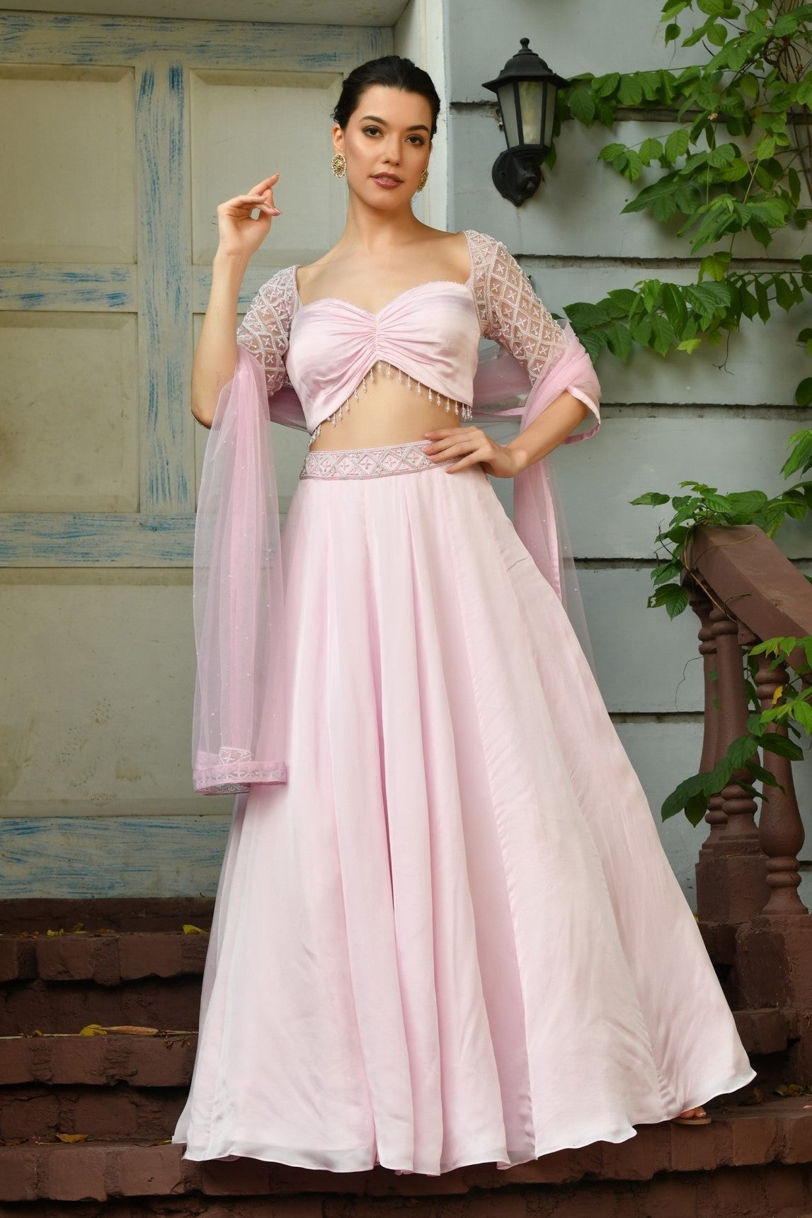 Indo Western Lehenga for Women – Elegant bridal lehenga with intricate embroidery and a modern crop top blouse, perfect for festive occasions. - Stunning pink bridal lehenga set, perfect for engagements or special occasions. This elegant lehenga choli features western design blouse ideal for women looking for elegant style. The Sunanta madaan's designer blouse and lehenga offers a perfect blend of tradition and modern style.