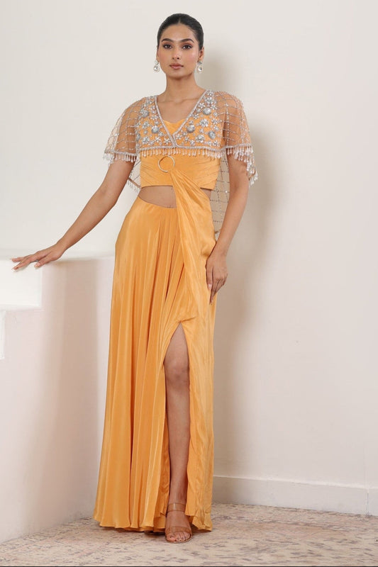 Woman in a yellow evening gown with a white background