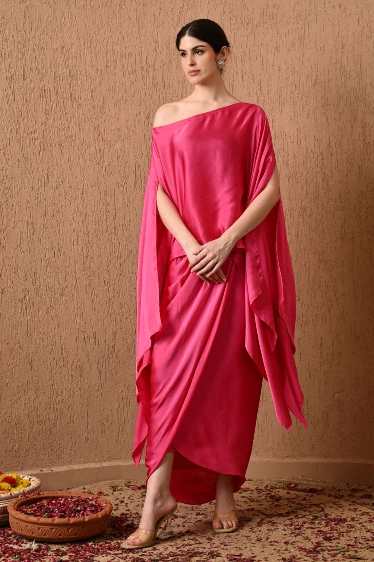 Luxury Pink Kaftan Dress with Draped Skirt by Sunanta Madaan – Elegant designer kaftan dress for women, featuring a modern draped silhouette, perfect for weddings, parties, and festive occasions. Shop kaftan dress online in India from Sunanta Madaan, a premium women’s designer brand in Gurgaon. This Indo-Western kaftan gown blends contemporary style with ethnic charm, making it ideal for bridesmaids, cocktail events, and resort wear. Buy designer kaftan dress for wedding | Party wear kaftan dress