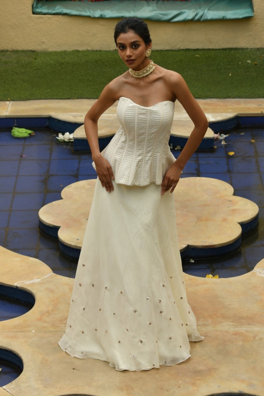 Elegant lehenga set with modern corset design, perfect for summer. This stunning lehenga with corset is ideal for evening wear, combining contemporary style with traditional flair. A beautiful corset lehenga set designed by Sunantamadaan, perfect for festive occasions like Diwali.