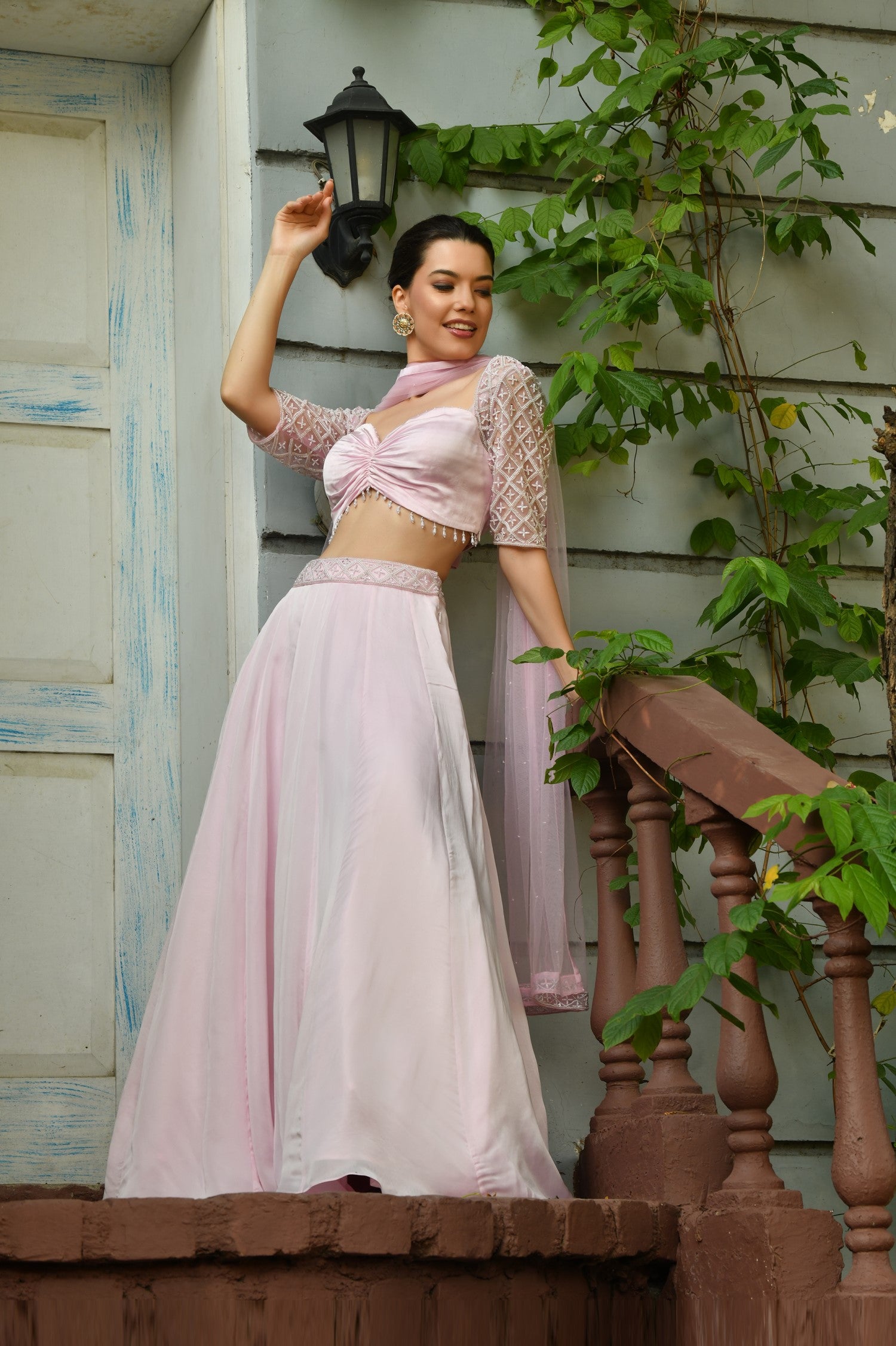 Festive and wedding wear Indo Western Lehenga Choli with delicate embroid-  Indo Western lehenga set in light pink, featuring a stylish new design perfect for a modern wedding. This bridal lehenga choli design includes a chic crop top lehenga, combining contemporary fashion with traditional elements. Ideal for brides, this Sunantamadaan lehenga offers a unique and sophisticated look. Explore this beautiful pink wedding lehenga at an online lehenga store for a memorable and fashionable wedding ensemble.