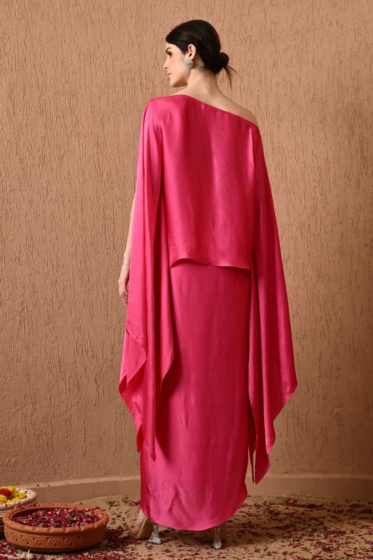 Luxury Pink Kaftan Dress with Draped Skirt by Sunanta Madaan – Elegant designer kaftan dress for women, perfect for weddings, festive wear, and party occasions. This Indo-Western kaftan gown features a stylish draped skirt for a modern, sophisticated look. Shop designer kaftan dress online in India from Sunanta Madaan, a premium women’s fashion brand in Gurgaon. Explore the latest kaftan-style party dresses 