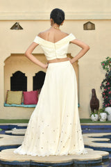 Ivory Indo-Western lehenga set, perfect for festive wear, occasion wear, and marriage party wear. This trending bridal lehenga combines traditional and western styles, making it a stunning choice for party wear with designer details. Sunanta Madaan