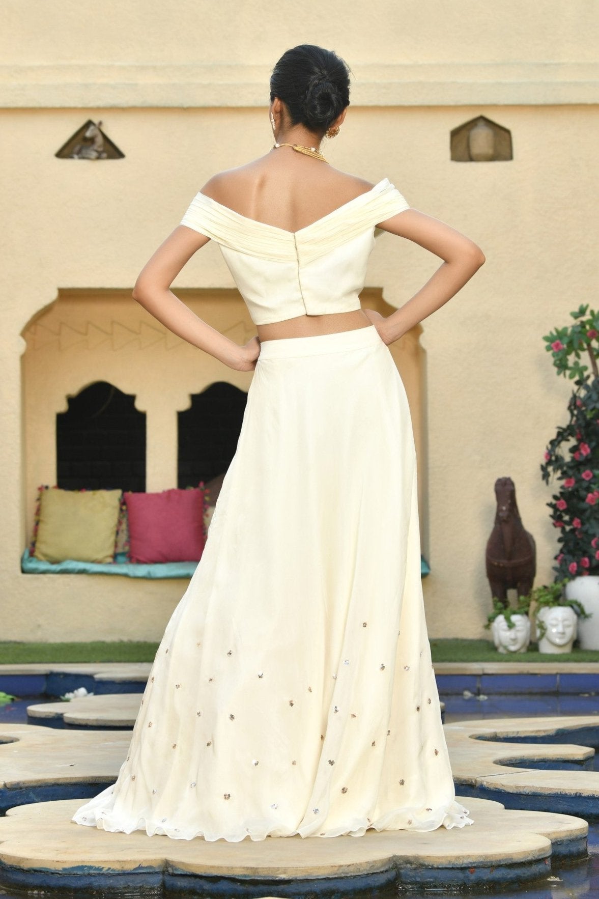 Ivory Indo-Western lehenga set, perfect for festive wear, occasion wear, and marriage party wear. This trending bridal lehenga combines traditional and western styles, making it a stunning choice for party wear with designer details. Sunanta Madaan