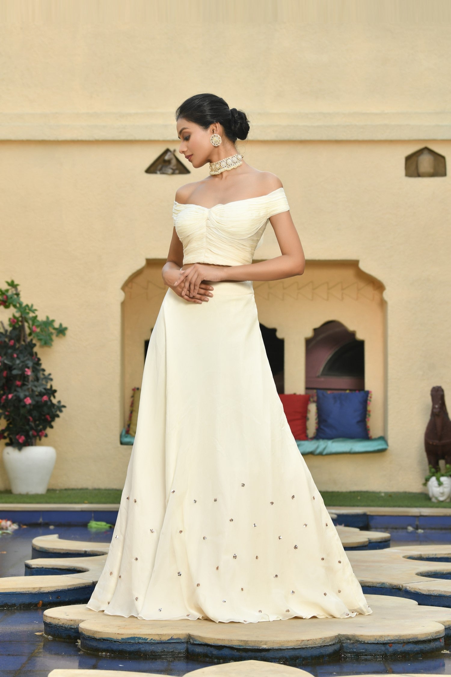 Elegant Indo-Western lehenga set featuring simple lehenga designs with a crop top, perfect for bridesmaids or weddings. This white bridal lehenga with lehenga choli is inspired by Sunanta Madaan's style and crafted with luxurious organza fabric for a sophisticated look. 
