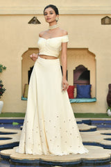 Ivory Indo-Western lehenga set with blouse, perfect for Diwali, Mehendi, Sangeet, and weddings. This elegant lehenga set is also an ideal choice for destination weddings, combining traditional charm with modern style for any celebration. Sunanta Madaan