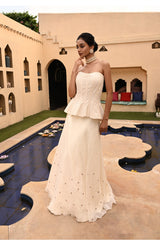 Stunning ivory corset lehenga with intricate sequin work, perfect for a pre-wedding shoot or cocktail party. This elegant corset lehenga set is also an ideal choice for bridesmaids or festive occasions. Designed by Sunantamadaan, this lehenga combines traditional charm with modern flair, making it a must-have for any special celebration.