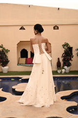 Elegant bridal lehenga featuring a beautiful corset-style crop top. This designer bridal lehenga from Sunantamadaan is perfect for weddings, showcasing trending white lehenga designs. A stunning off-white lehenga ideal for brides, available for lehenga shopping online at a trusted lehenga store. Shop now for the latest collection of lehengas for weddings and find your dream bridal outfit.