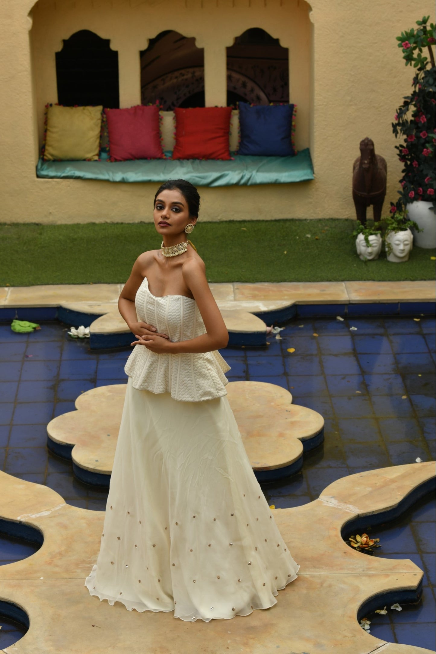 Graceful ivory lehenga with a corset from Sunantamadaan, designed as a stunning ladies lehenga for wedding. This beautiful dress lehenga design blends traditional and modern styles, featuring an Indo-Western lehenga look. Perfect for a marriage or wedding, this lehenga dress is a unique choice for brides looking for a fashionable dress design lehenga with a sophisticated touch.