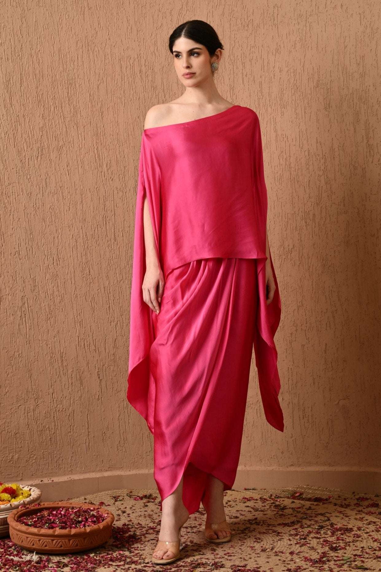 Luxury Pink Kaftan Dress with Draped Skirt by Sunanta Madaan – Elegant designer kaftan dress for women, perfect for weddings, festive wear, and evening parties. This Indo-Western kaftan gown features a stylish draped skirt, ideal for a sophisticated and modern look. Buy designer kaftan dress online in India from Sunanta Madaan, Gurgaon’s leading luxury fashion brand. Elevate your wardrobe with this trending kaftan outfit for special occasions. Shop premium women’s fashion | Party wear kaftan dress