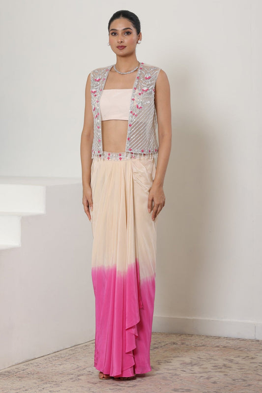 Woman wearing a traditional outfit with a pink and white saree and floral blouse. Ivory pink skirt dress, viscose crepe outfit, pre-draped designer wear, premium occasion attire, elegant festive ensemble, Sunanta Madaan, near me, Mumbai, Delhi, Hyderabad, Bangalore, Pune