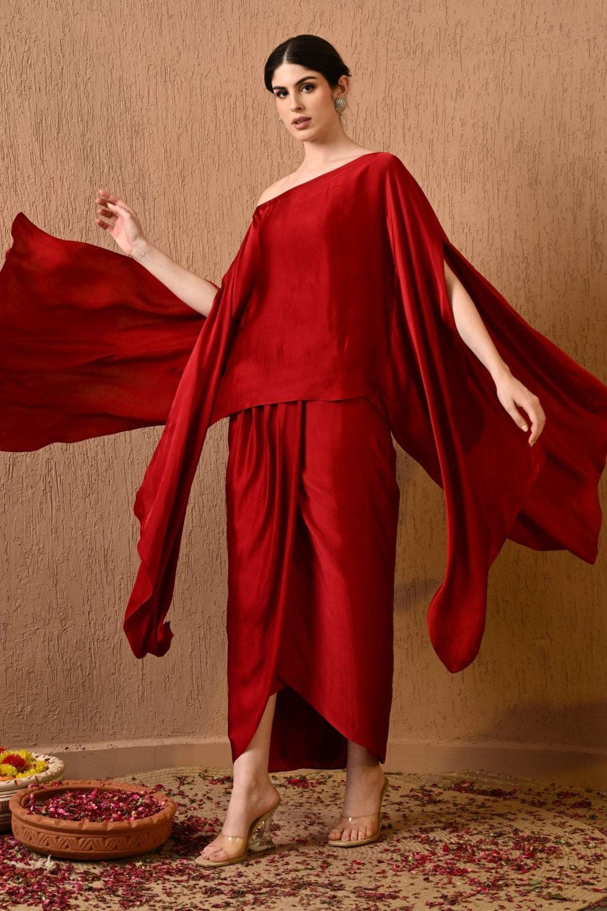 Luxurious red satin kaftan dress with draped skirt for weddings and festive events, Stylish red satin dress with draped skirt for bridal and cocktail parties, Stylish red satin dress with draped skirt and dropped shoulder for chic parties by Sunanta Madaan